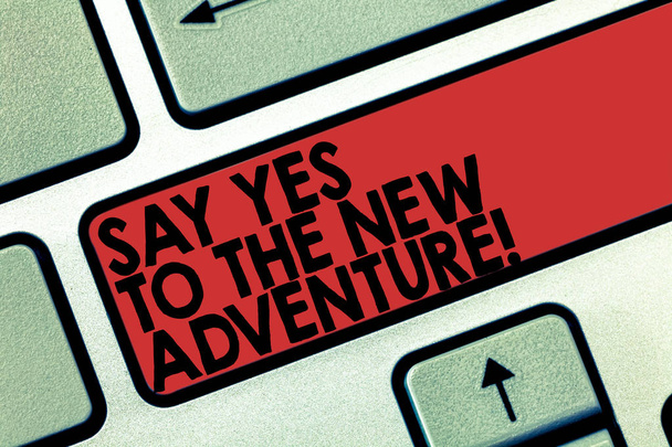 Word writing text Say Yes To The New Adventure. Business concept for Exploring the world traveling life experience Keyboard key Intention to create computer message pressing keypad idea. - Photo, Image