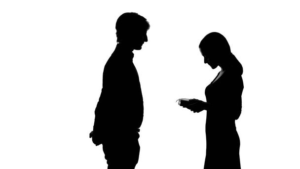 Female silhouette looking at boyfriends gift, romantic relationship, dating - Фото, зображення