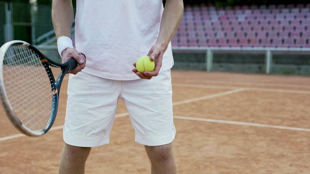 Experienced tennis player serving ball to opponent, racket sport and hobby - Fotó, kép