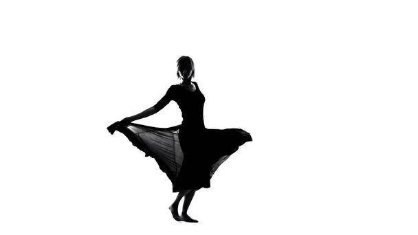 Young inspired woman in dress dancing, freedom and femininity, sensual flamenco - Foto, Imagen