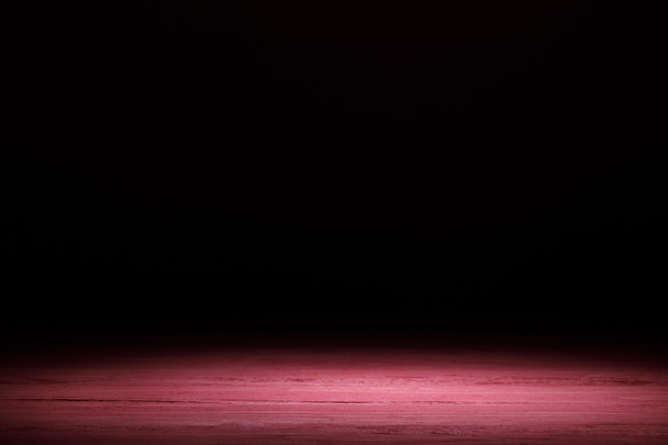 pink striped wooden surface on black - Photo, Image