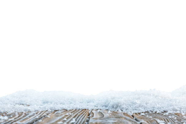 tablero de madera marrón cubierto de nieve sobre blanco
 - Foto, Imagen
