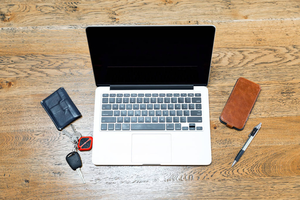 Laptop and other accessories on the desk - Valokuva, kuva