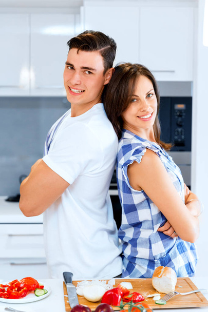 Couple cooking together at home - Фото, изображение