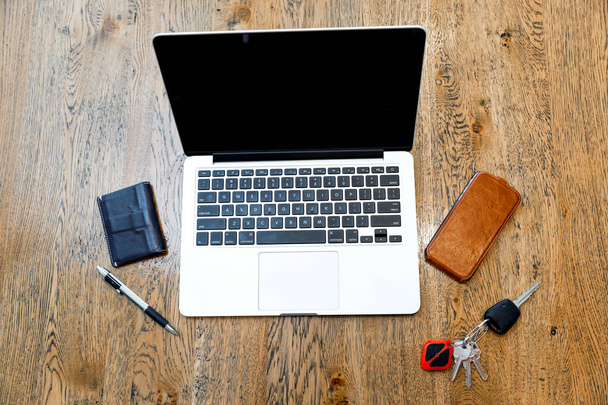 Laptop and other accessories on the desk - Foto, imagen