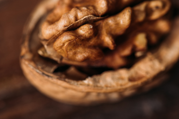 top view of walnut in nut shell as alzheimer symbol - Fotografie, Obrázek