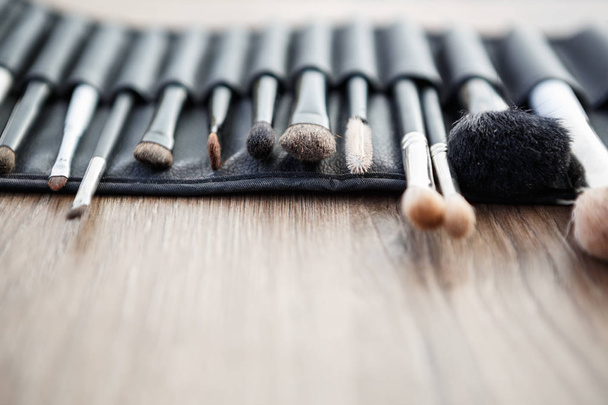 Set of professional face make up brush for visagiste.Beauty studio tools for facial makeup.Close up of brushes on visagiste makeup table for beautiful face paint  - Photo, Image