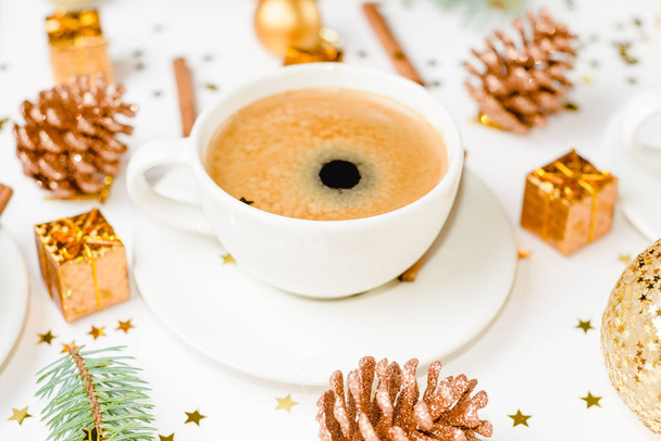 Creative natural layout of Christmas decorations with cups of coffee on a white background. Flat lay, Top view - Fotó, kép
