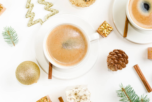 Creative natural layout of Christmas decorations with cups of coffee on a white background. Flat lay, Top view - Zdjęcie, obraz