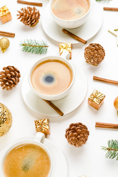 Top view of a cup of coffee, isolate on white with Christmas toys, pine cones, cinnamon, and New Year decor - Fotoğraf, Görsel