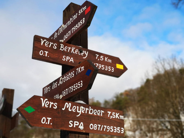 Finger post with directions to multiple walking routes in the area of Spa, Belgium, famous for its mineral springs and racing circuit. - Photo, Image