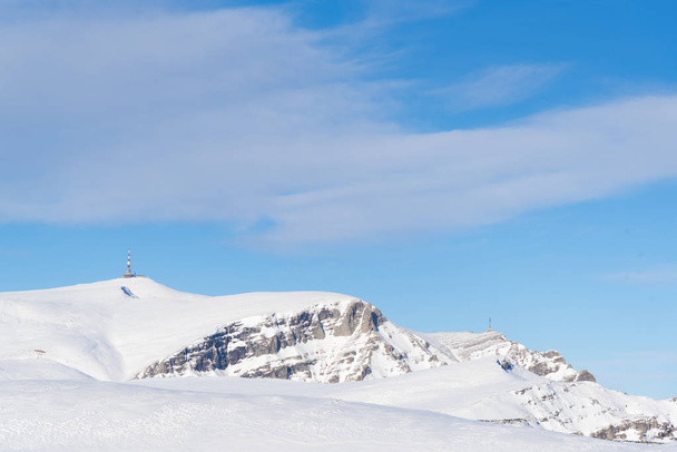 snowy mountainous landscape with blue sky - Zdjęcie, obraz