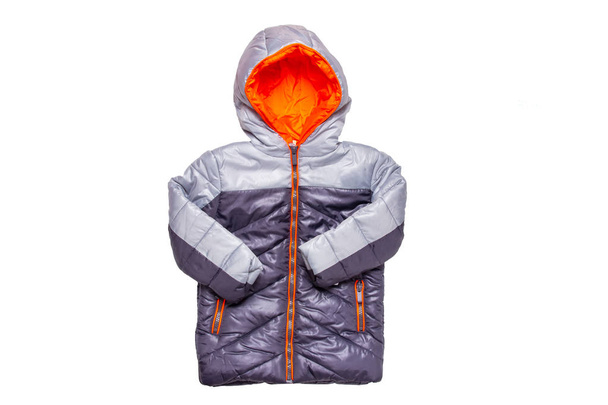 Winter jacket isolated. A stylish black warm down jacket with orange lining for the kids isolated on a white background. Childrens wear for winter. - Photo, image