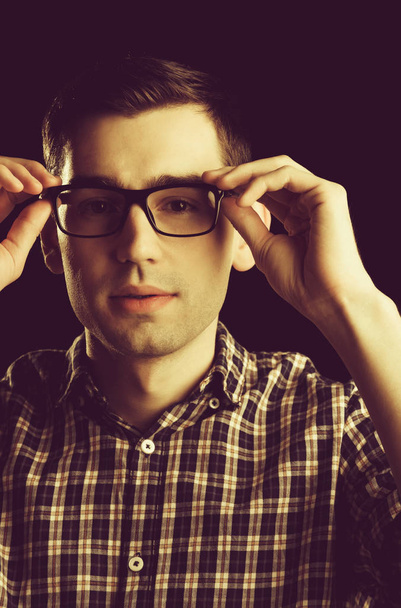 young guy, nerd in glasses and fashionable checkered shirt - 写真・画像