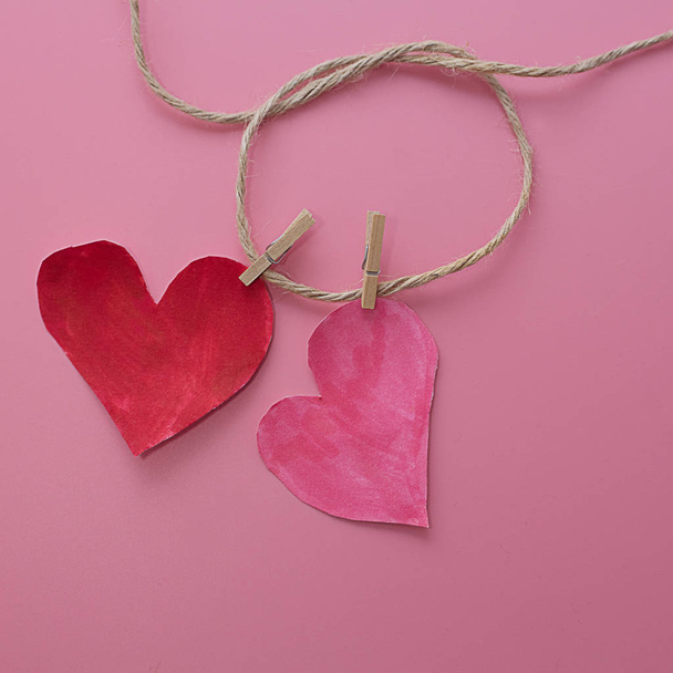 couple of love related hearts forever concept on pink background - Zdjęcie, obraz