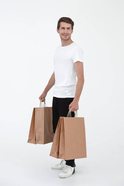 Guy satisfied carries bag - Foto, afbeelding