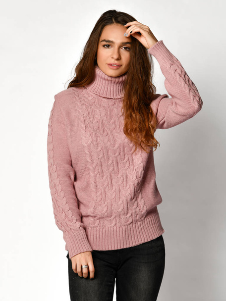 Young beautiful brunette curly woman posing in new casual pink purple blouse sweater  - Φωτογραφία, εικόνα