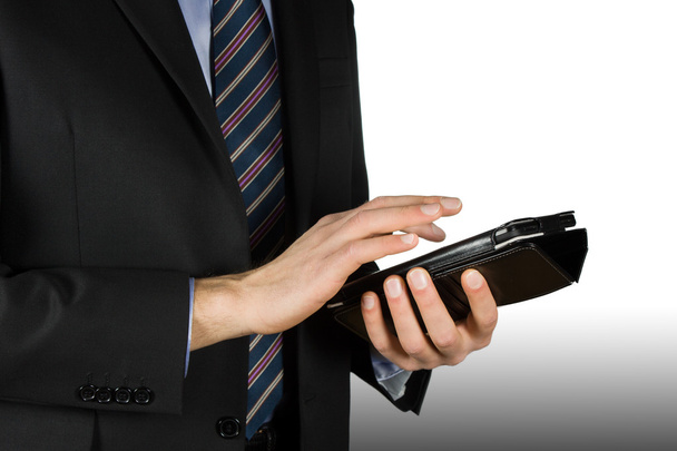 Business-man using a touch-screen device - Zdjęcie, obraz
