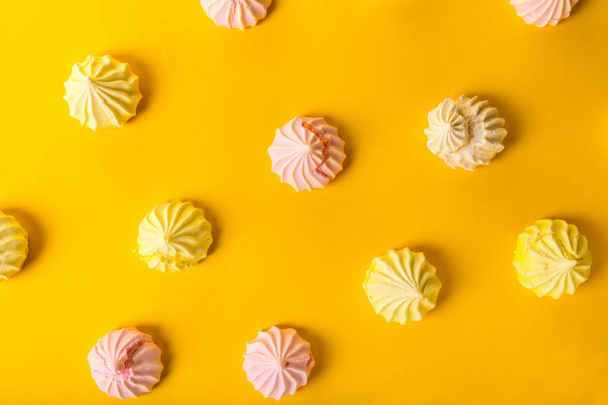 food background, dessert meringue on yellow - 写真・画像