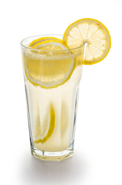Fresh lemonade in a glass on white background - Foto, afbeelding