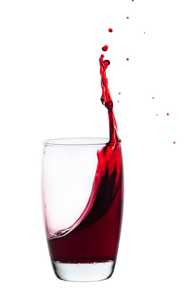 splash of drink from a glass, white isolated background - Φωτογραφία, εικόνα