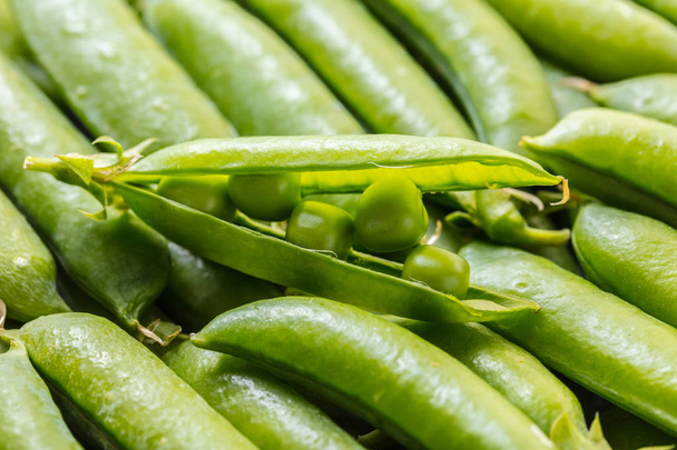 food background of a texture of green peas pods - 写真・画像