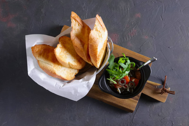 Crispy toasts with tomato, olives, arugula and cheese - Photo, Image