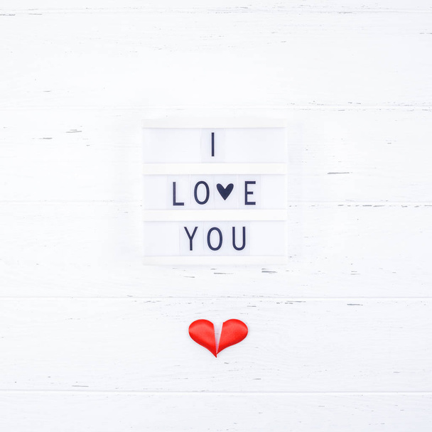Creative Valentine Day romantic composition flat lay top view love holiday celebration with red heart lightbox white wooden background copy space Template greeting card text design social media blogs - Photo, Image