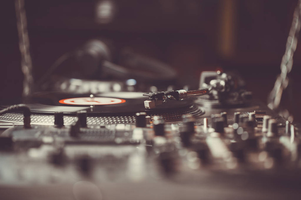 Turntable vinyl record player, analog sound technology for DJ playing analog and digital music. Close up, macro of equipment for professional studio, concert, event. - 写真・画像