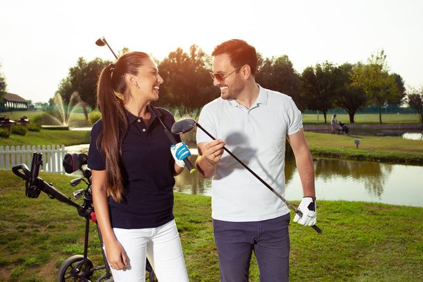 Happy couple feeling happy after golf game. - Image - Foto, imagen