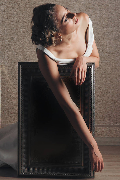 bride, model in beautiful pose photographed in studio with mirrors - Valokuva, kuva