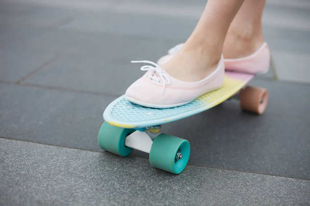  girls's legs on skateboard, close up - Φωτογραφία, εικόνα
