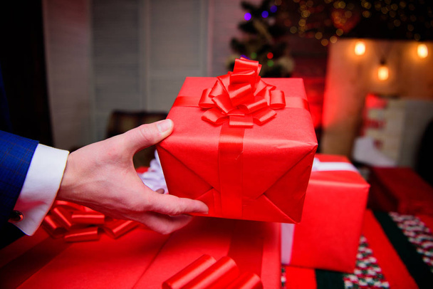 Gift boxes with big ribbon bow close up. Red wrapped gifts or presents. Wrapping gifts concept. Magic moments. Prepare surprise gifts for family and friends. Prepare for christmas and new year - Φωτογραφία, εικόνα