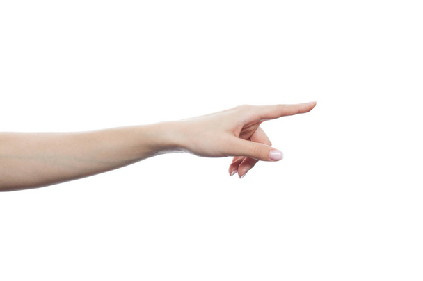 Mão feminina apontando e mostrando espaço de cópia isolado no fundo branco
 - Foto, Imagem
