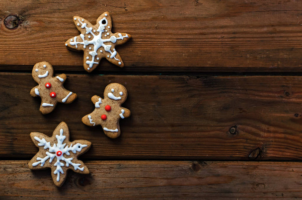 Homemade colorful gingerbread cookies on dark wooden background. Copy space - Fotó, kép
