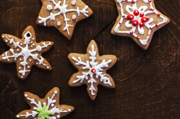 Homemade colorful gingerbread cookies on dark wooden background. Copy space - Foto, immagini