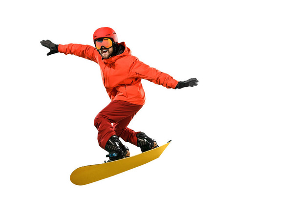 Portrait of young man in sportswear with snowboard isolated on a white background. - Φωτογραφία, εικόνα