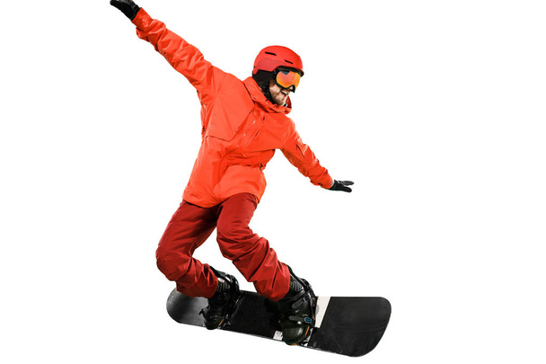 Portrait of young man in sportswear with snowboard isolated on a white background. - Foto, imagen