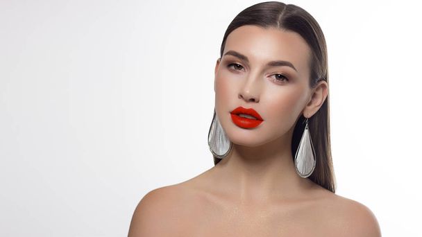 Sexual full lips. Natural gloss of lips and woman's skin. The mouth is closed. Increase in lips, cosmetology. Orange lips and long neck. Great summer mood with open eyes. fashion jewelry - Photo, Image
