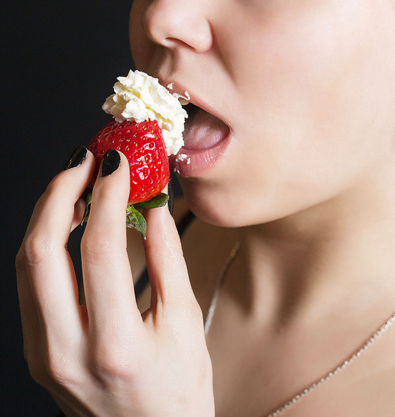 Portrait of the young girl with strawberry - Photo, Image