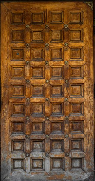 Texture of a wooden door with a triangular roof. Close-up, Background - Foto, Bild