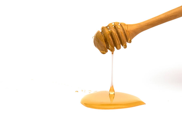 isolated honey dripper on white background  - Fotografie, Obrázek