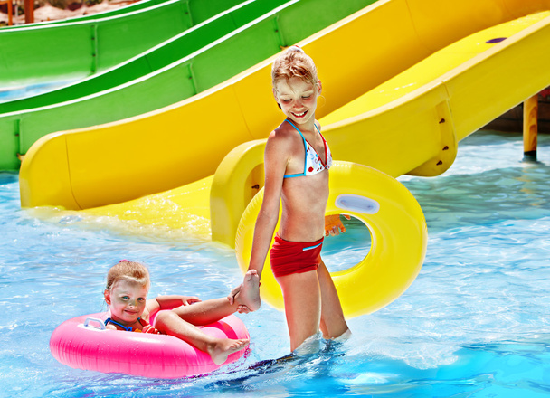 Children sitting on inflatable ring. - Photo, Image
