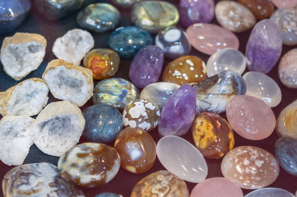 Heap of various colored gems. Colorful gemstones. Natural Polished Gemstone Semi Precious Rocks Colorful Background Texture Close Up Phot. - Photo, Image