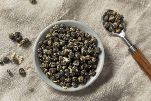 Dried Organic Jasmine Pearl Tea in a Bowl - Фото, изображение