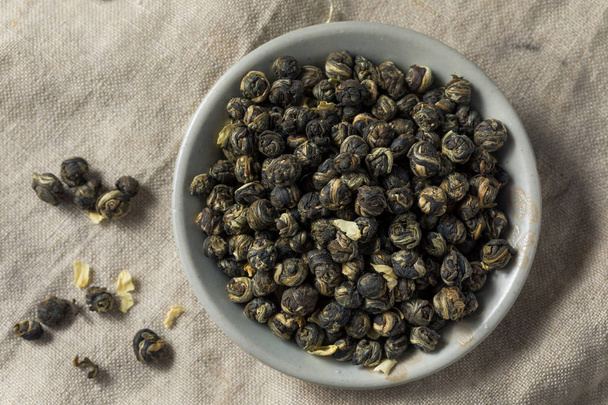 Dried Organic Jasmine Pearl Tea in a Bowl - Photo, image