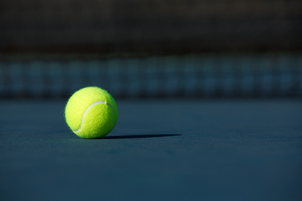 Tennis Ball on a Blue Court - Fotografie, Obrázek