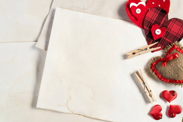 Handmade love hearts and sheets of blank paper  - Фото, зображення