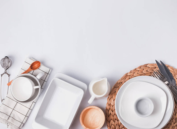 Different tableware and dishes on the white background, top view. - Foto, Bild