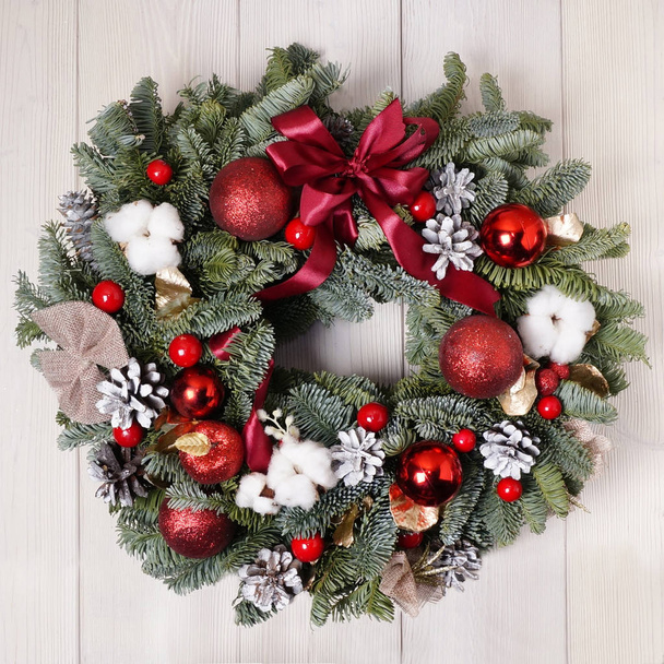Part of Christmas wreath on wooden door decoration - Φωτογραφία, εικόνα